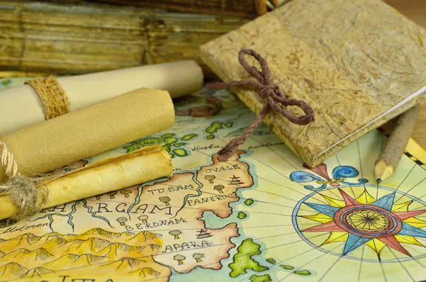 Diary with map and paper scrolls