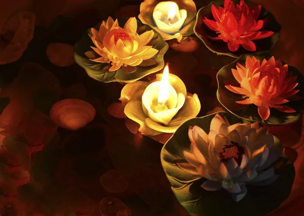 Lotus flower and burning candles