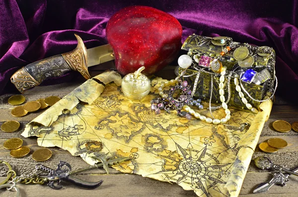 Pirate treasures with map and knife