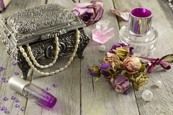 Vintage still life with lilac fragrances
