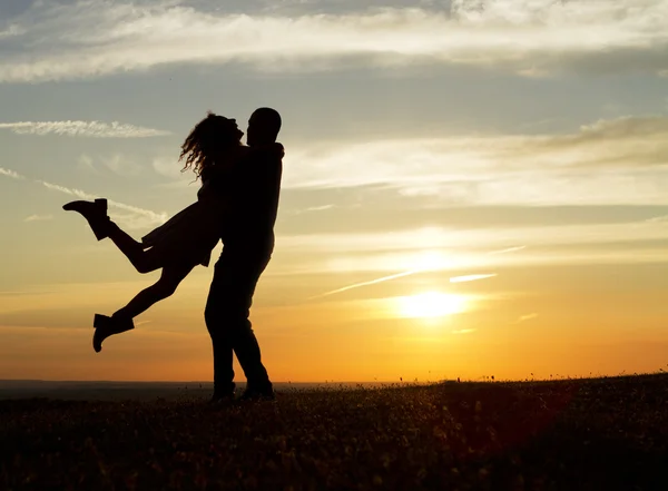 Happy couple at sunset