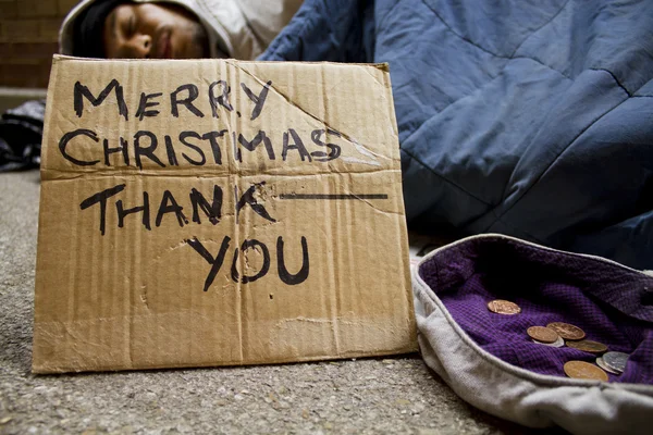 Homeless man sleeping on the streets at Christmas