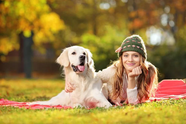 Female with her dog in a park