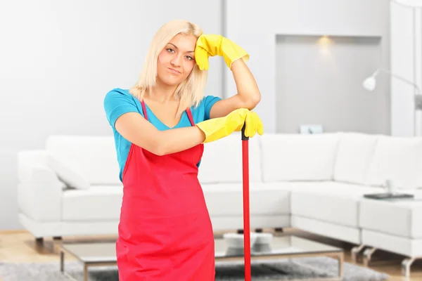 Tired female cleaner