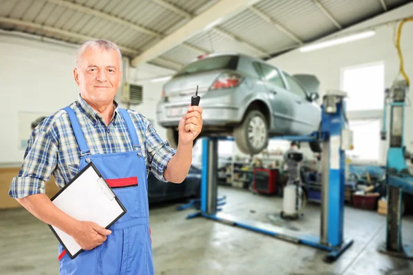 Mechanic holding car key