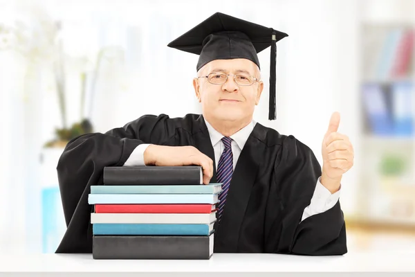 Professor with books gesturing happiness