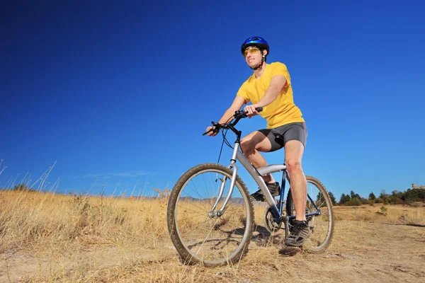 Male riding bike