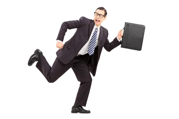 Scared male businessman running away