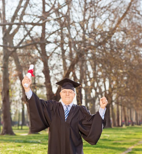 Mature man celebrating his graduation