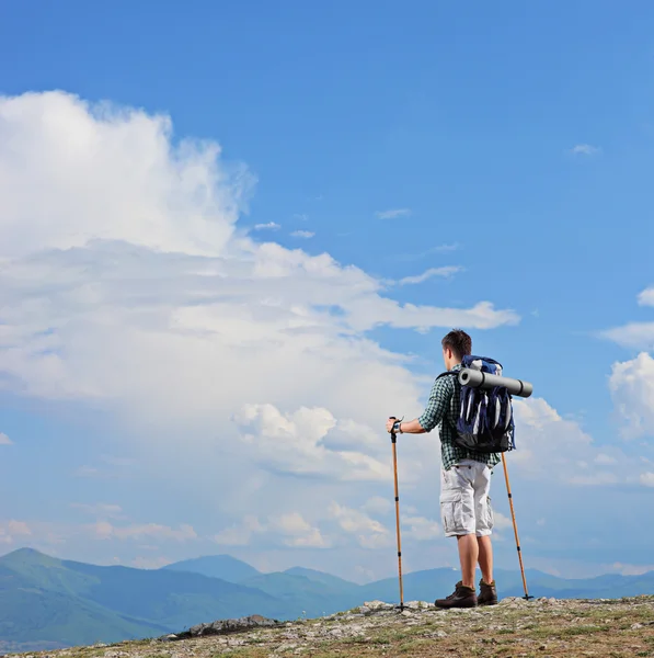 Hiker standing on mountain top