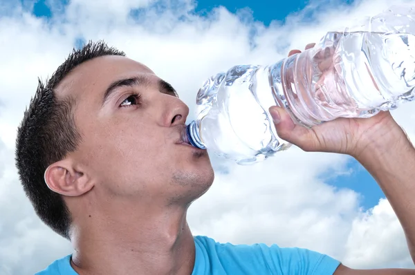 Young Latino drinking water