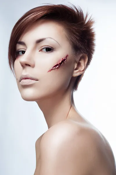 Girl with a cut on face