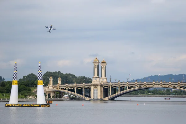 A plane flies over the course at the Red Bull Air Race World Championship 2014.