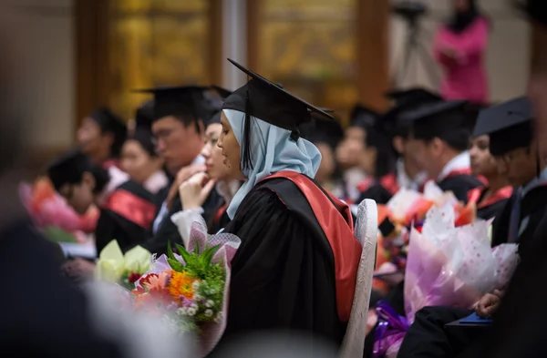 New graduates wait for their diploma