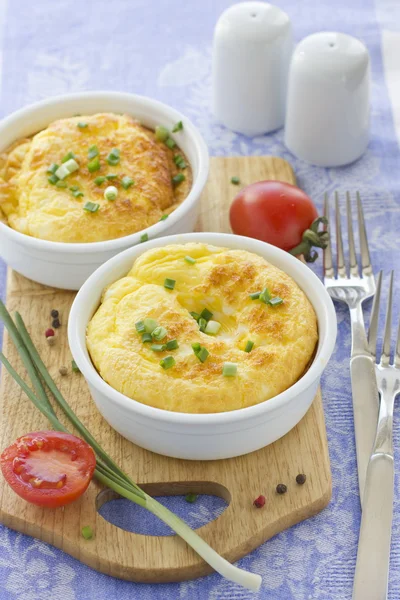 Scrambled eggs with cherry tomatoes and green onion