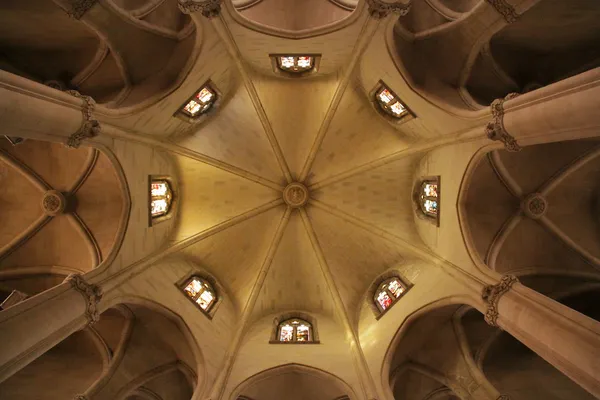 Ceiling of a church with vaulted ceilings and windows