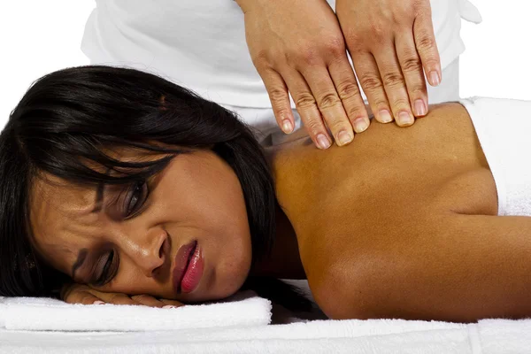 Woman getting painful massage