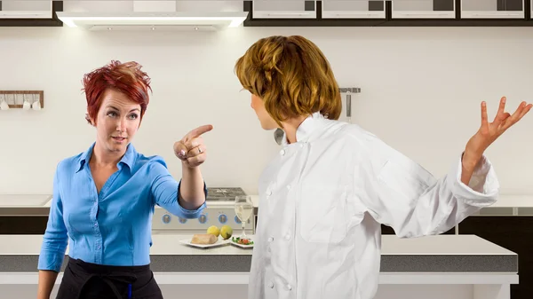 Chef and waitress fighting in the kitchen