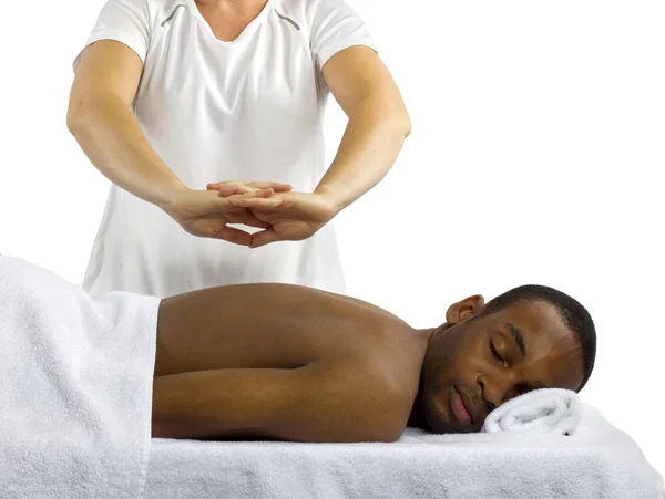 Female masseuse treating male client