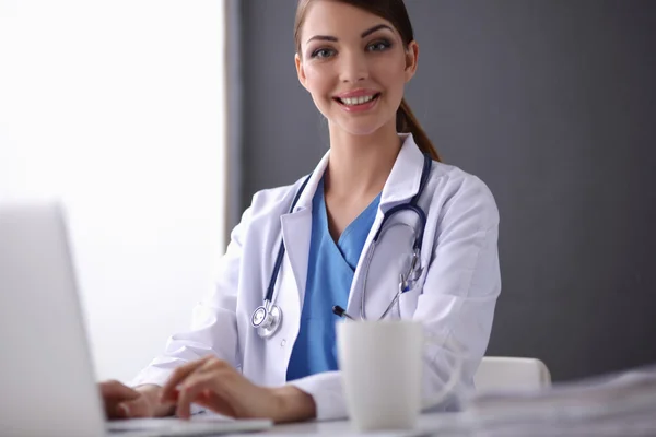 Female doctor working isolated on white background