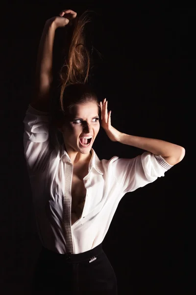 Portrait of a beautiful elegant girls on black background in the Studio with hair and make-up in a white shirt, credit