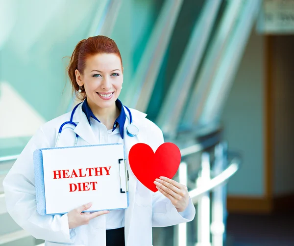 Female doctor holding healthy diet sign