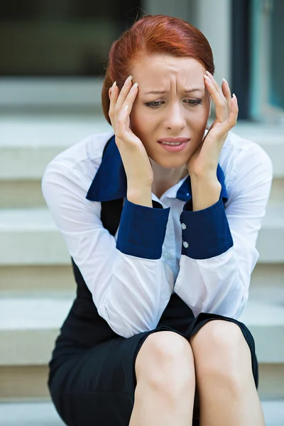 Portrait of a stressed businesswoman having headache