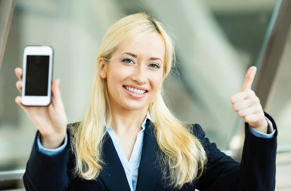 Happy excited businesswoman showing her smart phone