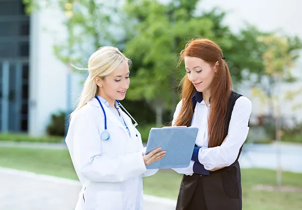 Doctor explaining to a petient treatment plan, lab results.