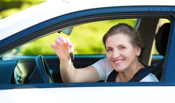 Happy woman showing  hew new car keys