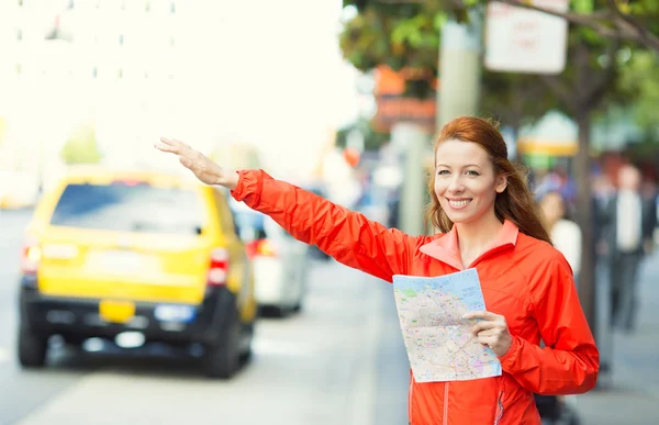 Girl calling taxi cab in New York City