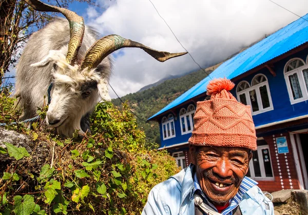 Unidentified man with goat