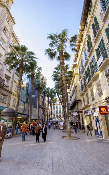 MALAGA - JUNE 12: City street view with cafeteria terraces and s