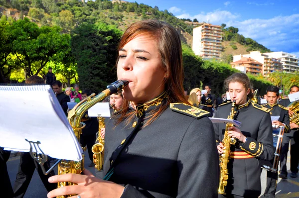 MALAGA, SPAIN - APRIL 09: Nazarenes and musicians from Semana Sa