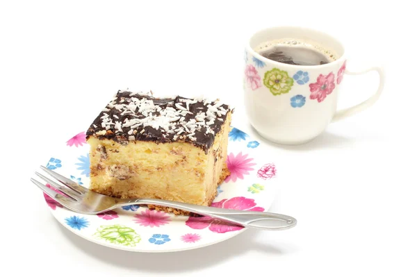 Delicious cheesecake on colorful plate and cup of coffee. White background