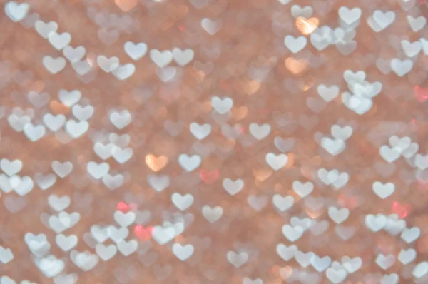 Defocused abstract hearts light background