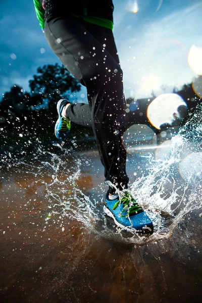 Single runner running in rain