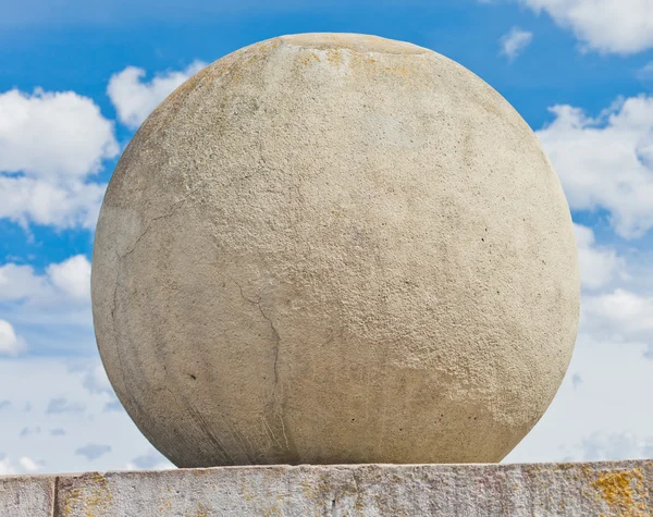 Stone (concrete) sphere against a sky background