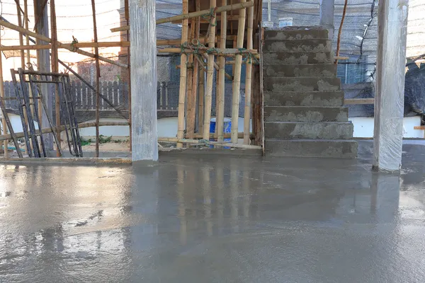 Floor wet mixed concrete at construction site