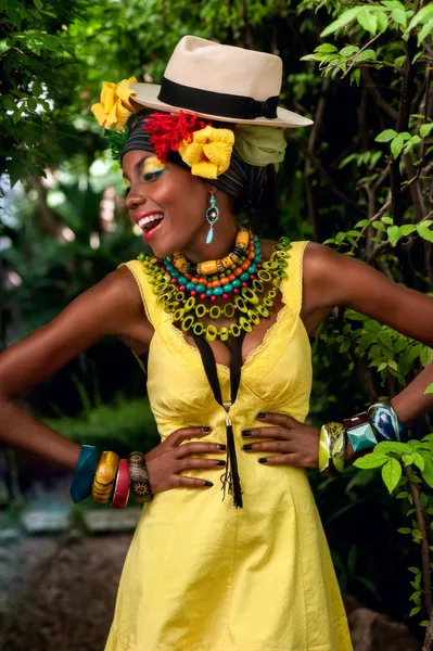 Laughing African woman in bright clothes
