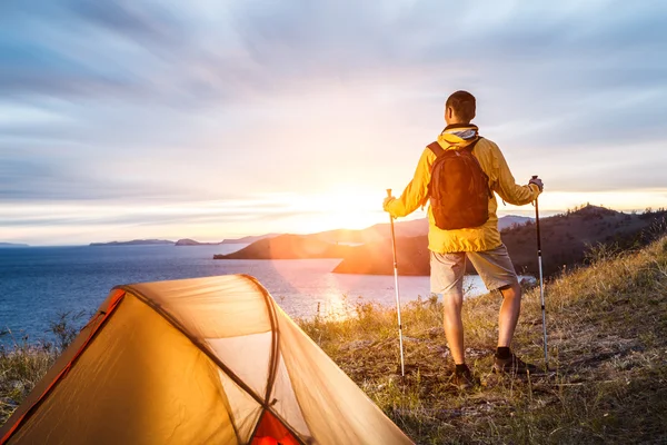 Backpacker in a camp