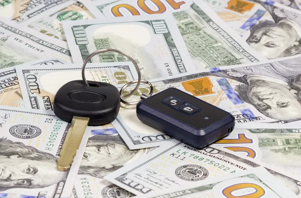 Car keys over dollar