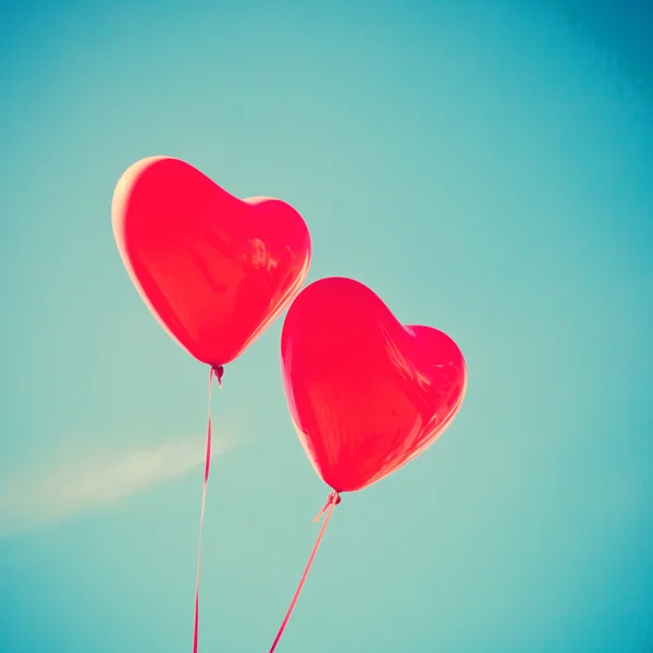 Retro love balloons on sky