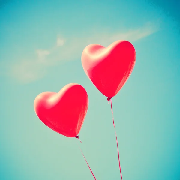 Retro love balloons on sky