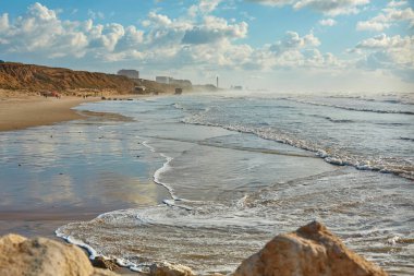 Seashore in Tel Aviv. Waves in the sea.