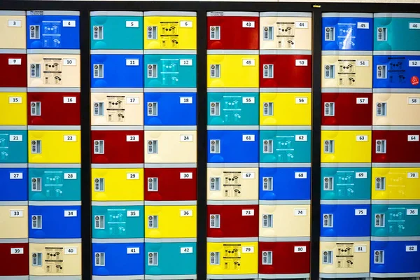 Colorful postal boxes in residential building hall.