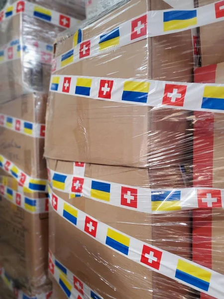 Boxes with humanitarian aid for Ukraine in volunteer centre warehouse. Dnipro, Ukraine - 06.30.2022