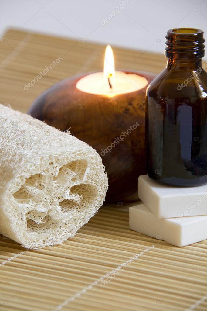 Aromatherapy Candle and Massage oil in a Zen Style Spa Stock Photo by