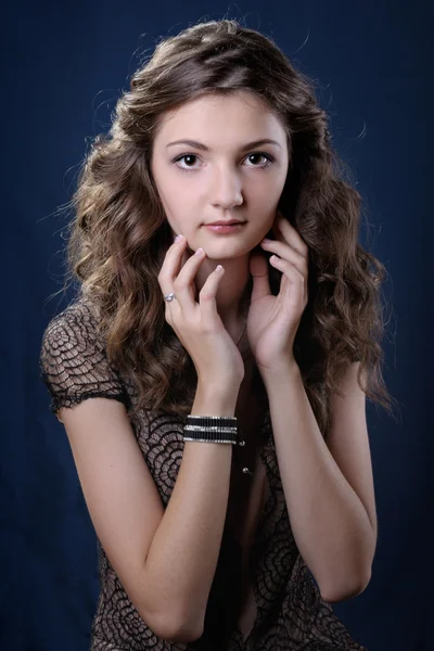 Girl with long curly hair. — Stock Photo, Image