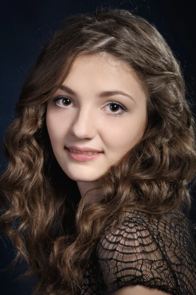 Girl with long curly hair. — Stock Photo, Image